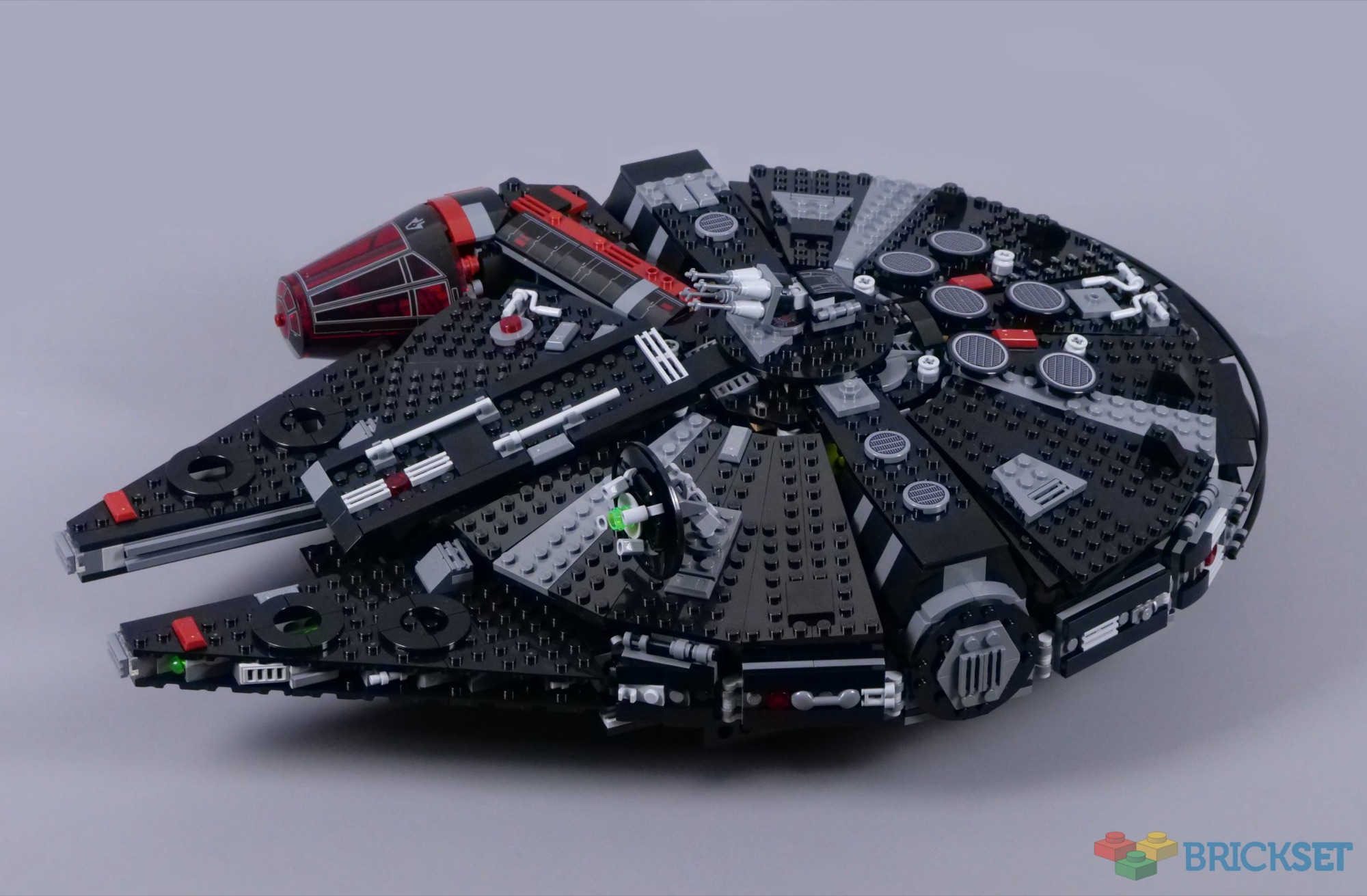 Exterior of LEGO Dark Falcon 75389 showing its black hull, red panels and cockpit on the right side