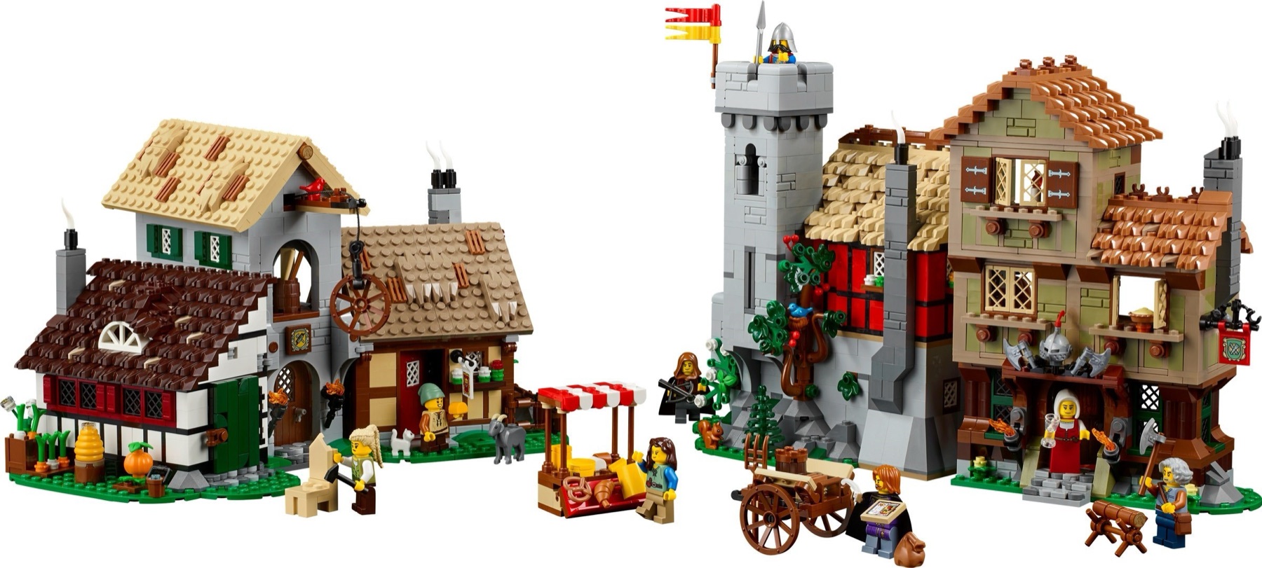 Complete LEGO Medieval Town Square 10332 display with farmhouse, inn, watchtower, market stall, cart and eight minifigures