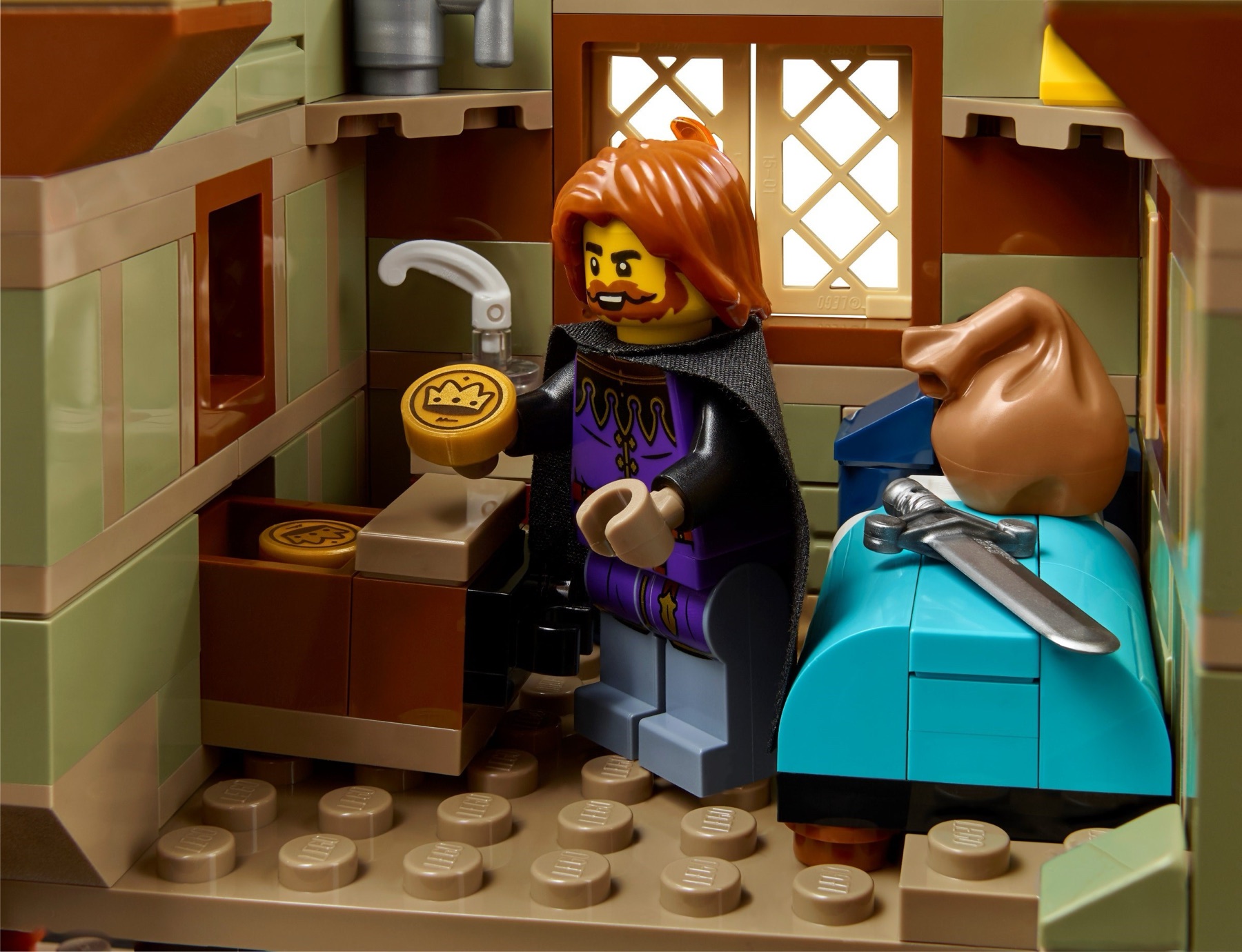 Tax collector finding coins in a hidden compartment inside LEGO Medieval Town Square 10332