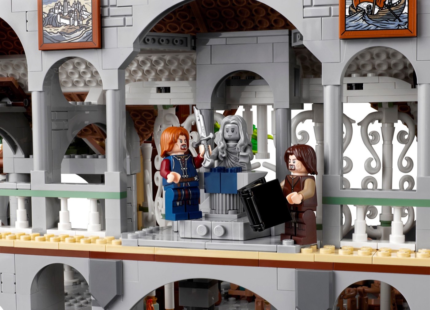 Close view of the LEGO Rivendell interior with Boromir and Aragorn minifigures beside the shards of Narsil