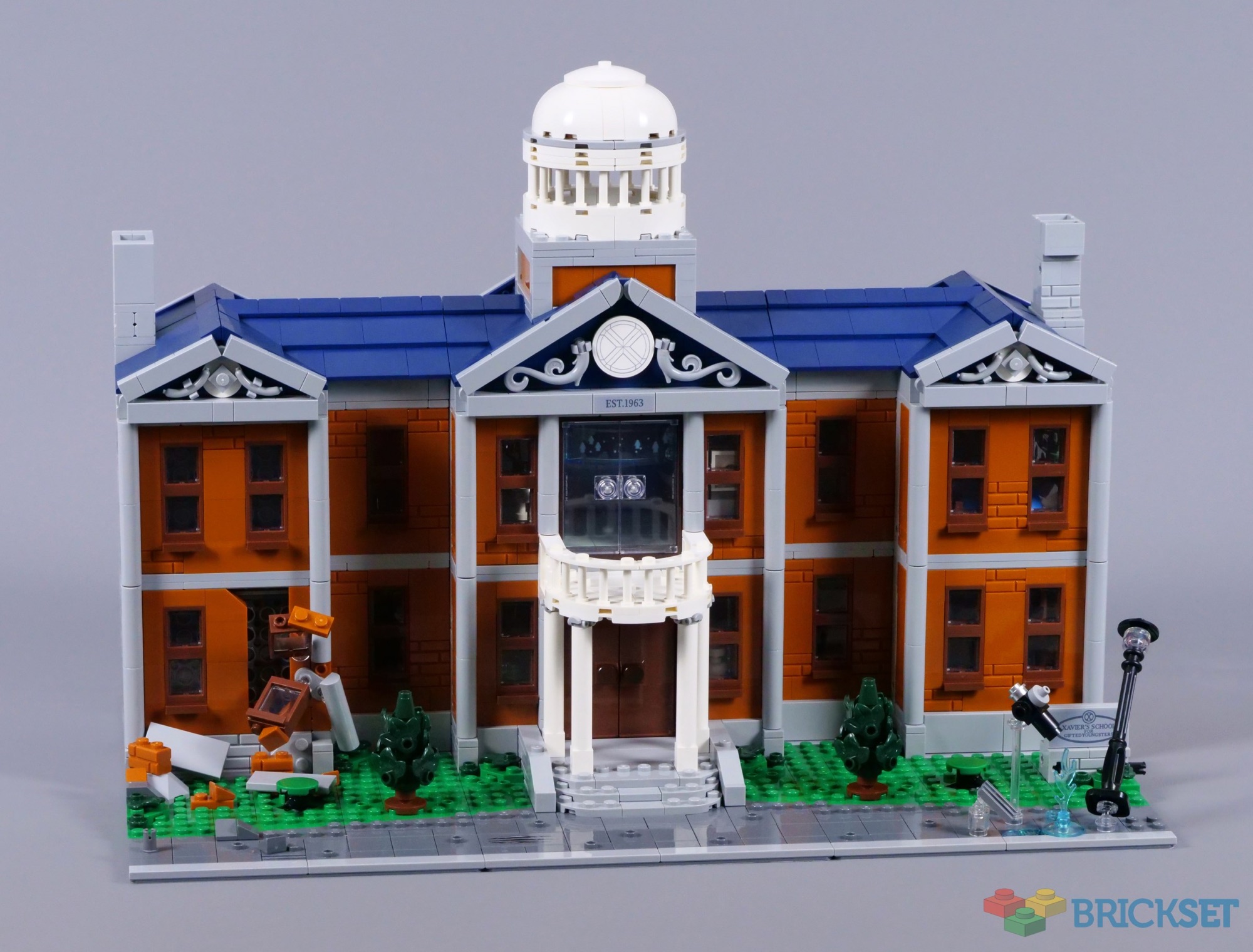 Front of LEGO X-Mansion 76294 with dark orange walls, dark blue roof and the central entrance portico